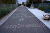 Fuzzy Boundaries names chalked on the Railpath